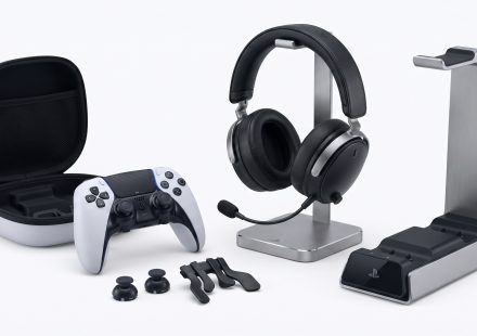 PlayStation 5 controller, headset, storage drive and gaming accessories arranged together