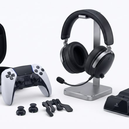 PlayStation 5 controller, headset, storage drive and gaming accessories arranged together